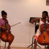 Taiwo collaborates with a student to perform a cello duet! Photo by Richard Casamento. 